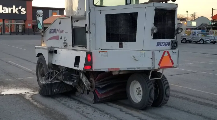 Parking lot sweeper truck at a Winnipeg commercial property